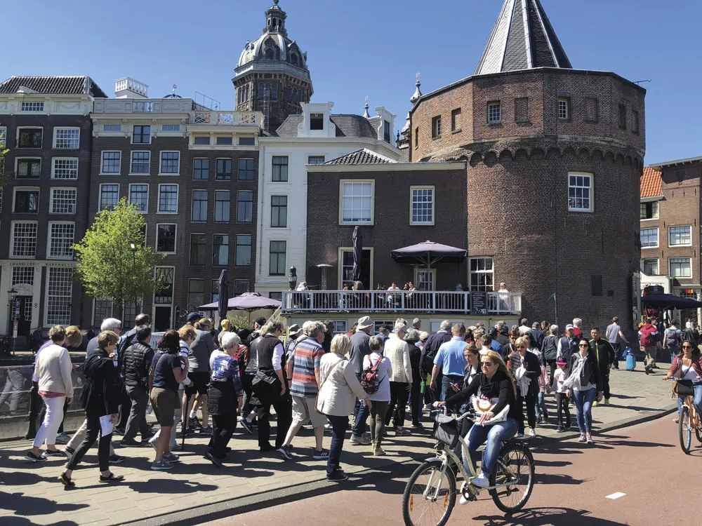 Guided city tour group exploring historic European city
